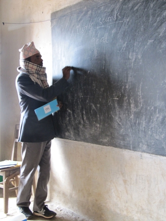 Children and teachers wear hats here as it can be very cold, especially inside bare, stone classrooms